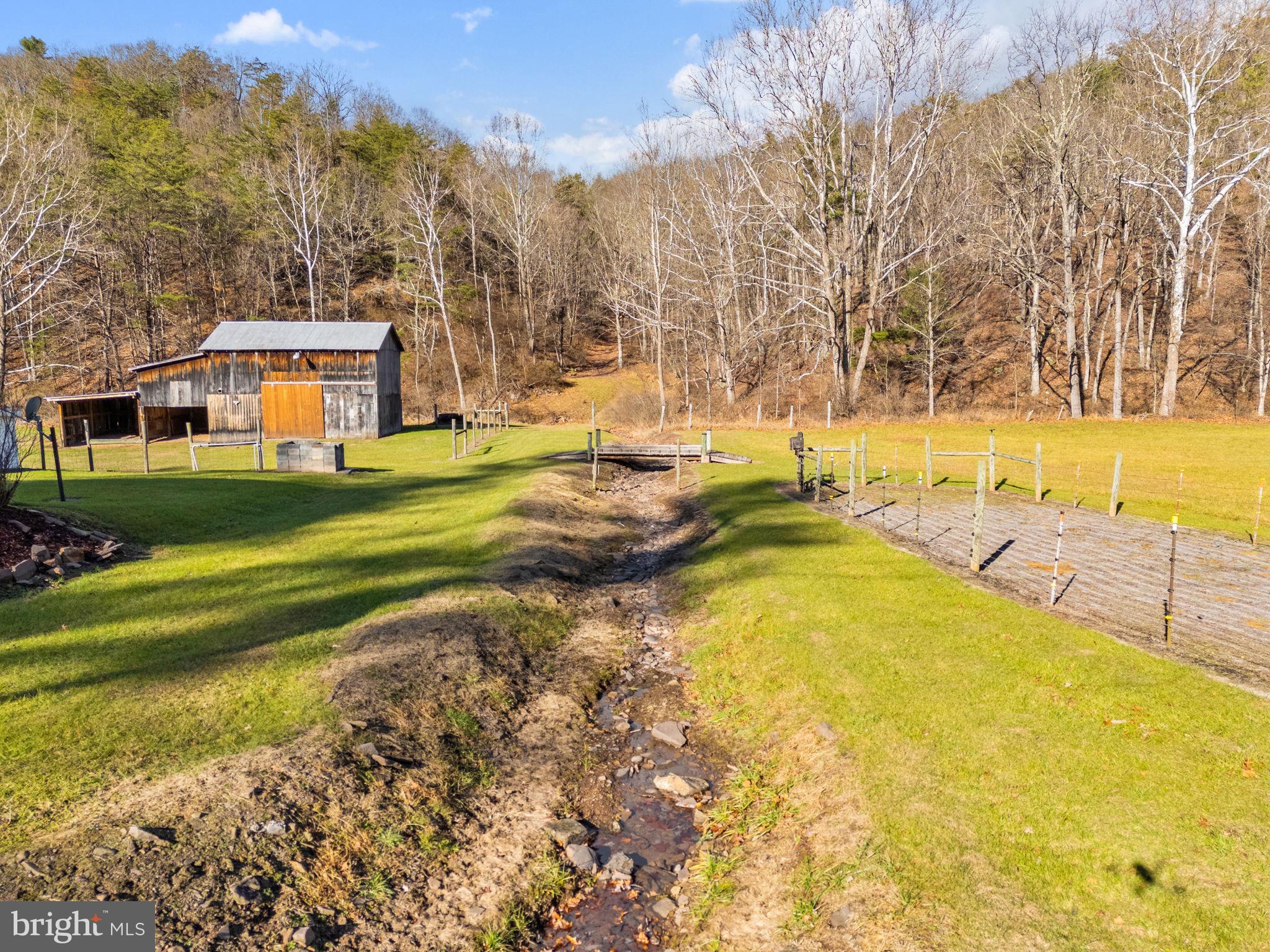 10500 Ford Hill Road Rio, WV 26755 - Photo 37 of 59 a view of a swimming pool and trees in the background