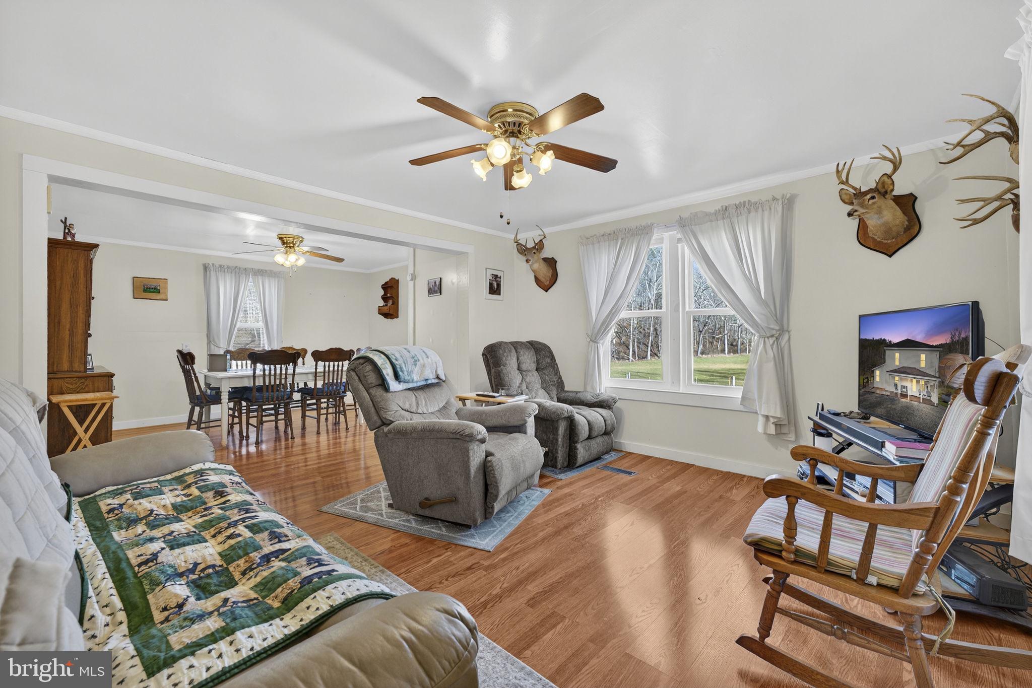 10500 Ford Hill Road Rio, WV 26755 - Photo 8 of 59 a living room with furniture a chandelier and a table