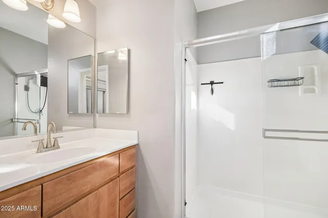 a view of a bathroom from a glass door