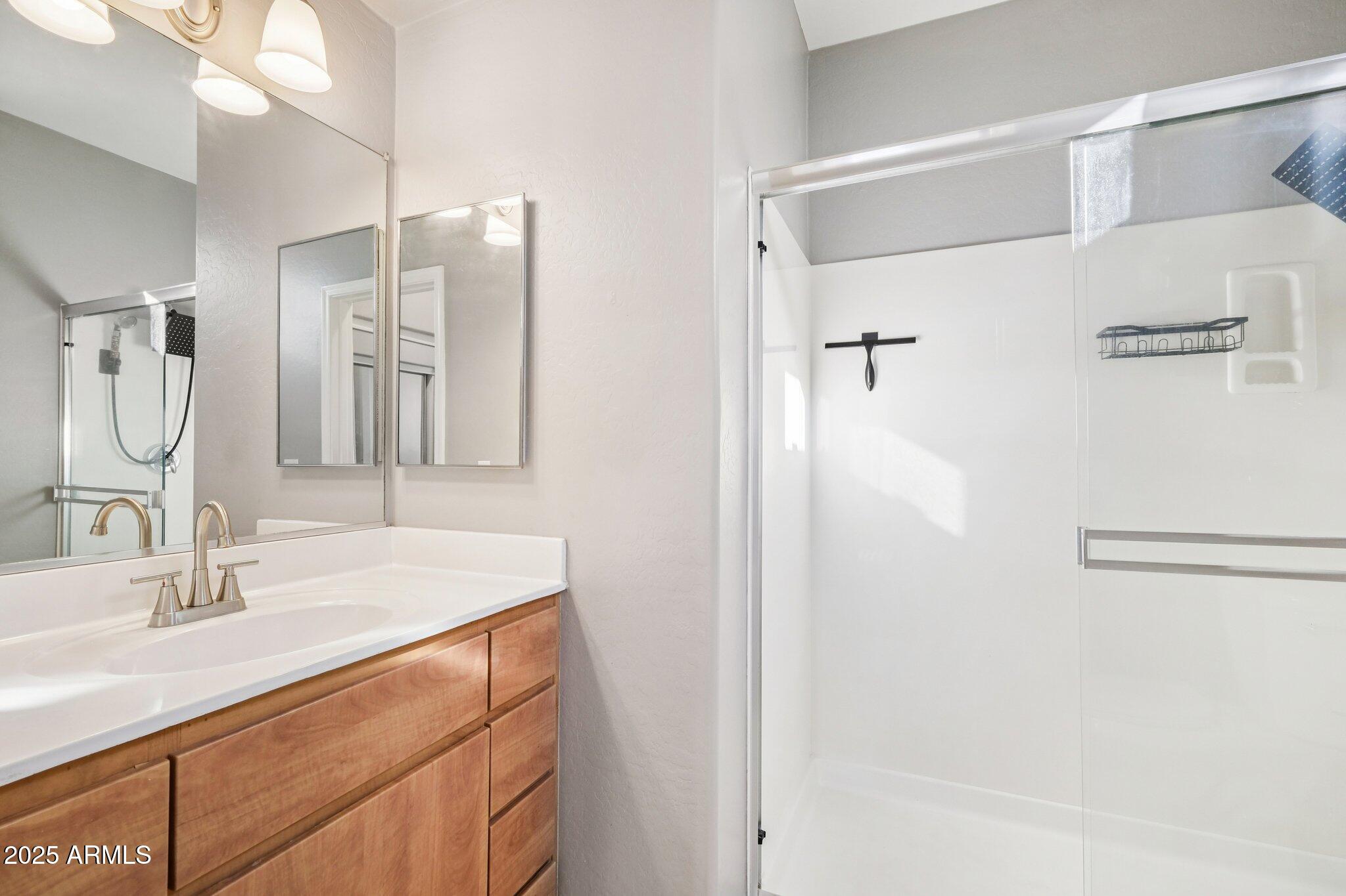 615 East Portland Street, Unit 115 Phoenix, AZ 85004 - Photo 15 of 32 a bathroom with a sink vanity granite tub and shower