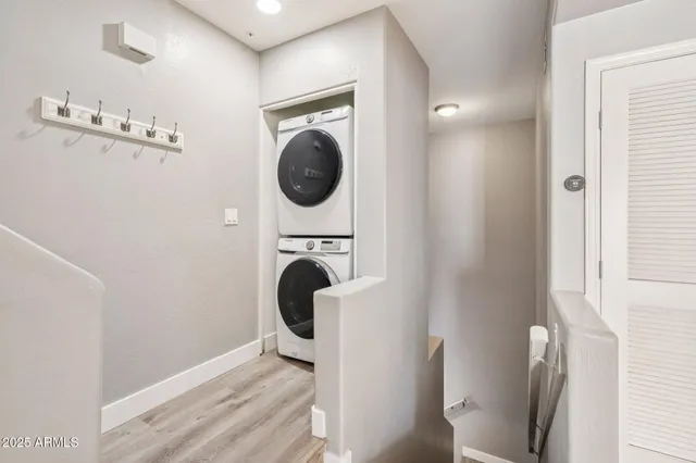 a bathroom with a sink toilet vanity and shower