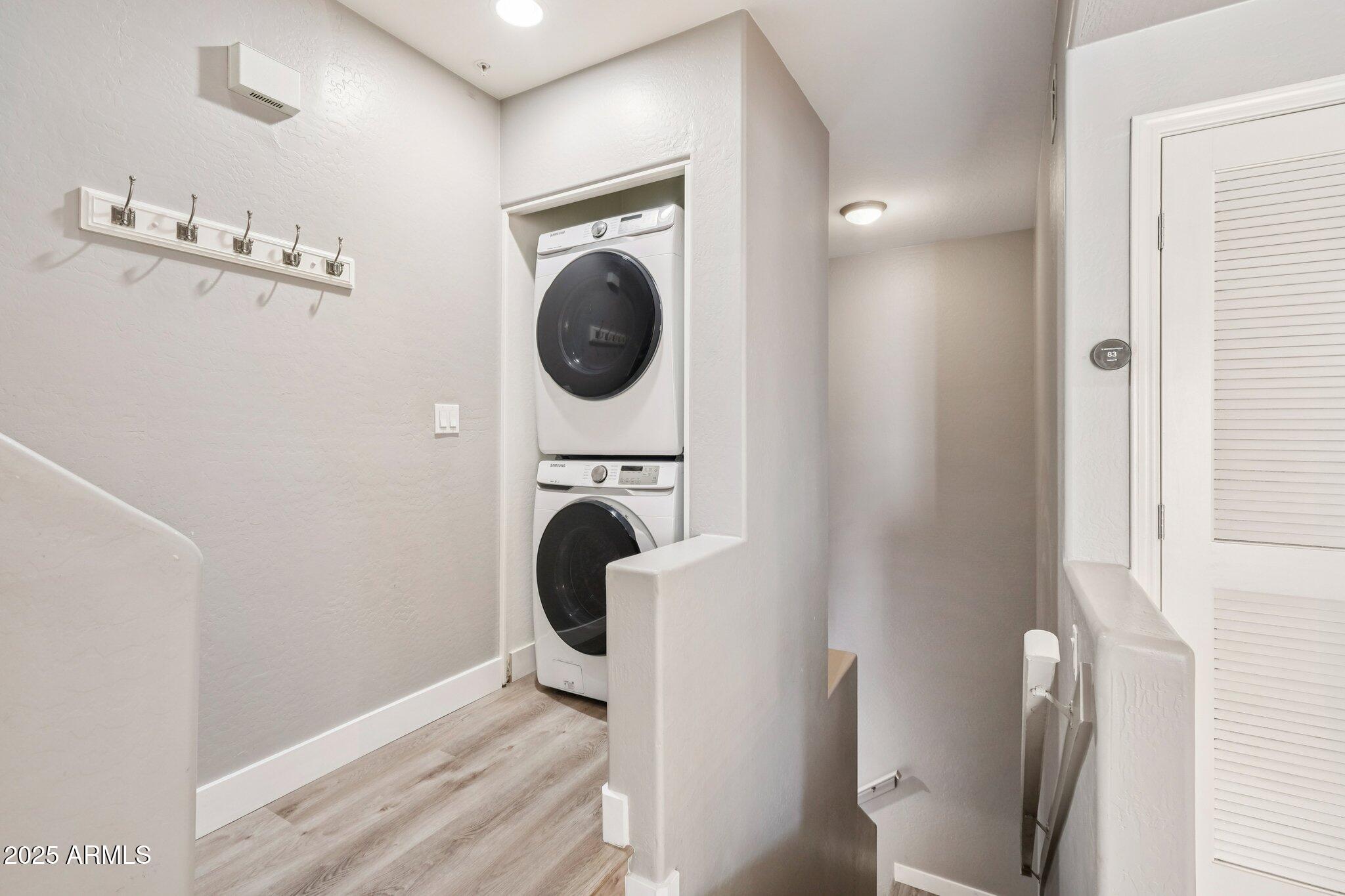 615 East Portland Street, Unit 115 Phoenix, AZ 85004 - Photo 17 of 32 a view of a hallway with washer and dryer