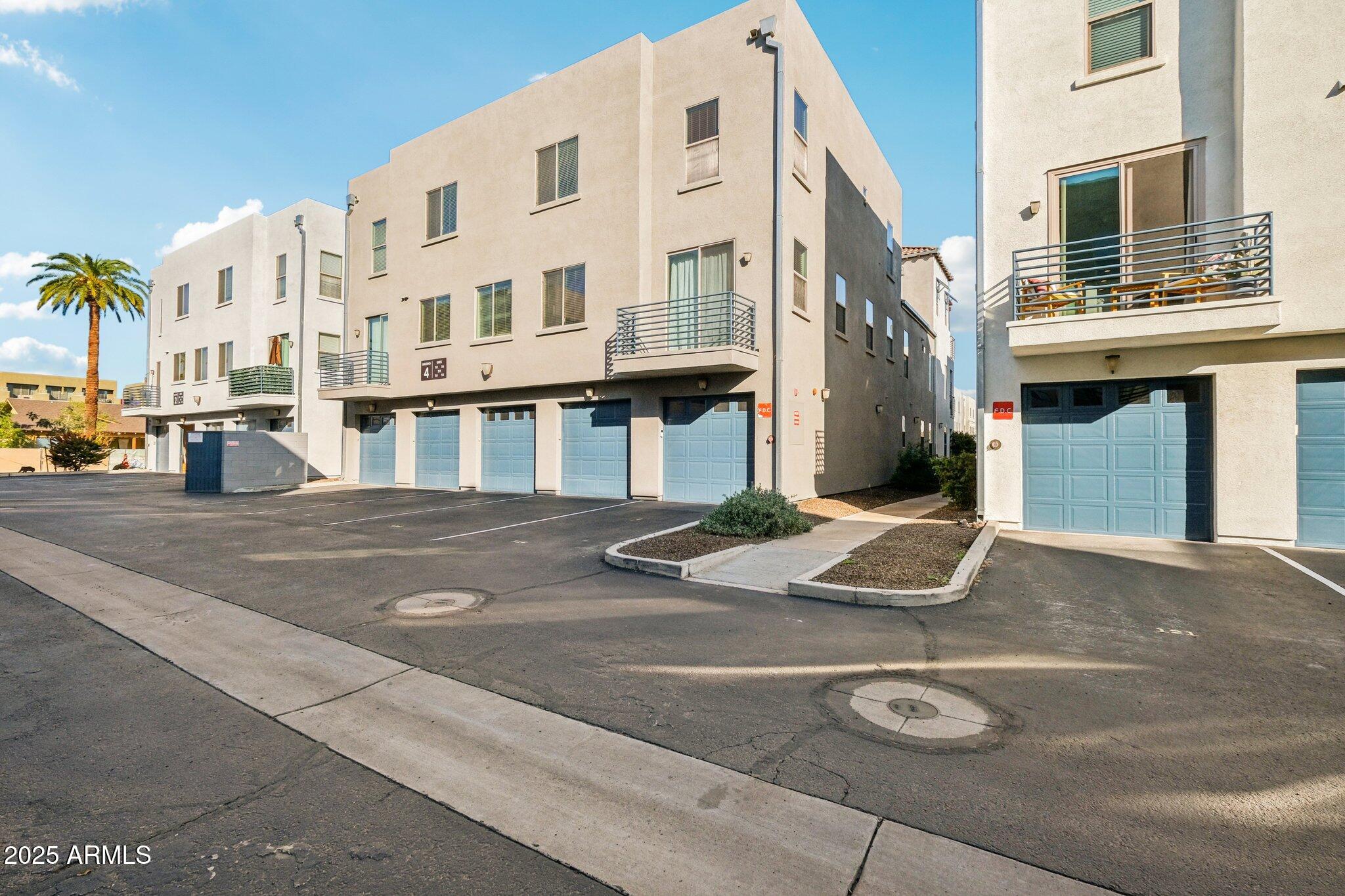 615 East Portland Street, Unit 115 Phoenix, AZ 85004 - Photo 18 of 32 a view of a building with car parked