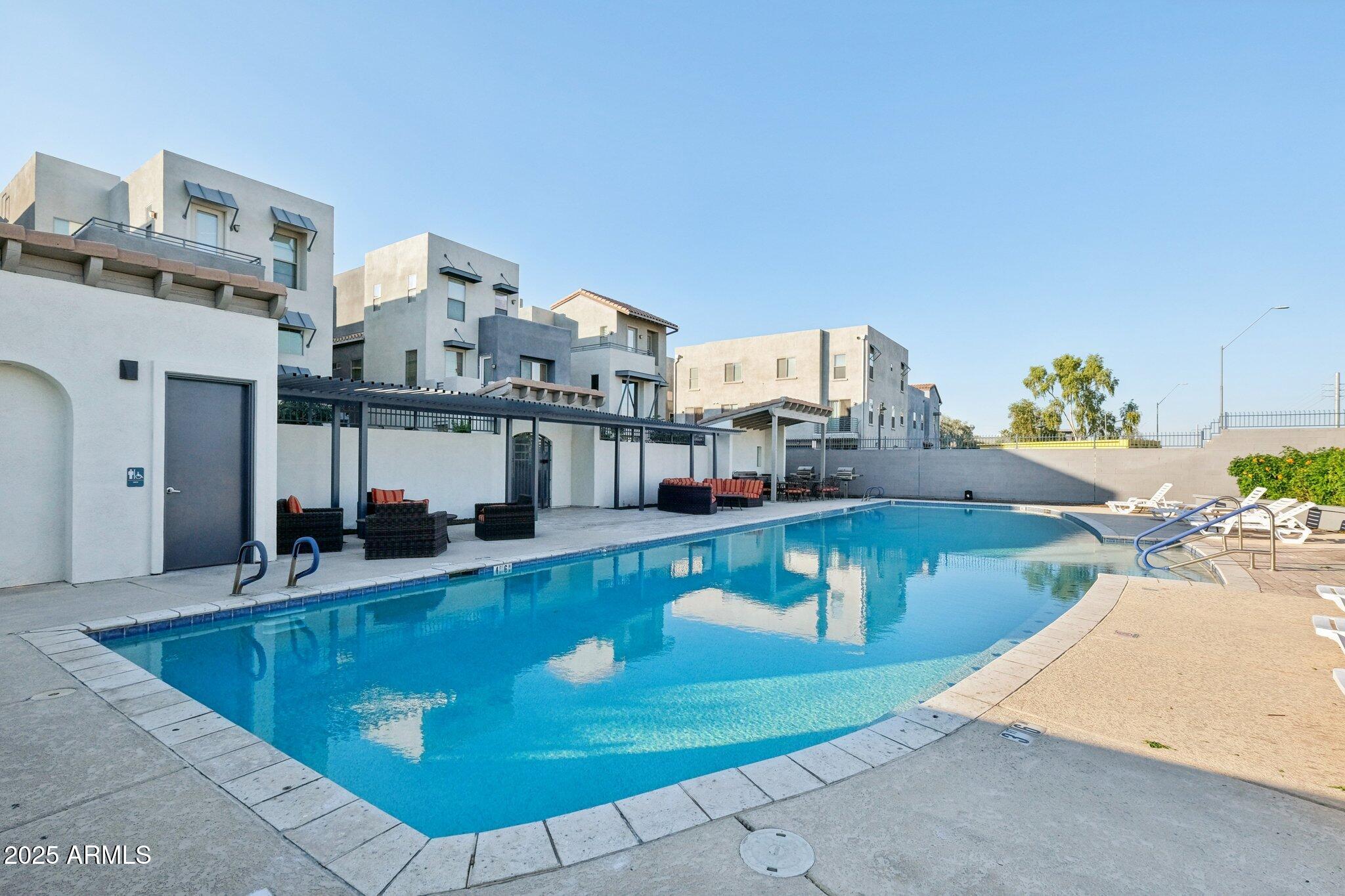 615 East Portland Street, Unit 115 Phoenix, AZ 85004 - Photo 21 of 32 a view of a living room and kitchen