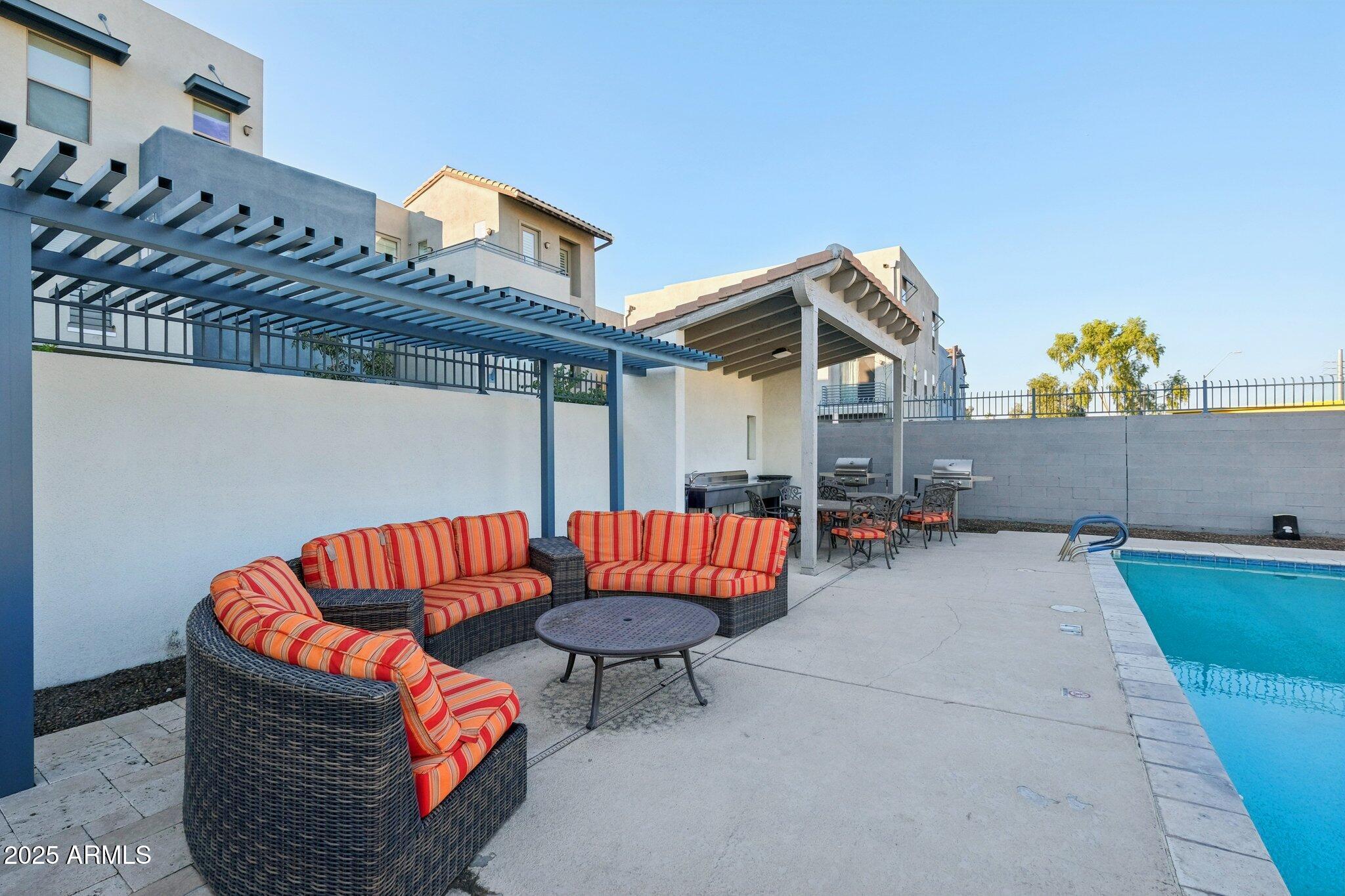 615 East Portland Street, Unit 115 Phoenix, AZ 85004 - Photo 24 of 32 a outdoor living space with patio furniture and a potted plant