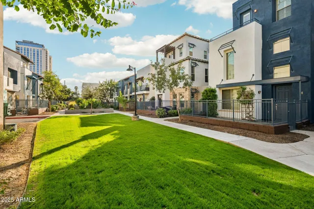 a view of a building with a yard