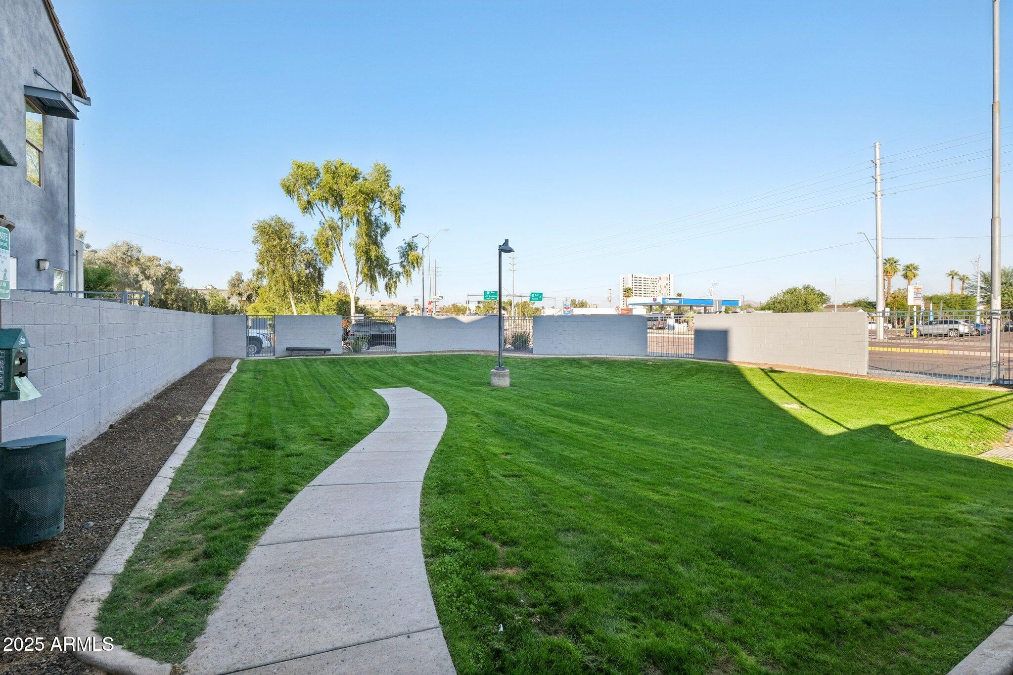 615 East Portland Street, Unit 115 Phoenix, AZ 85004 - Photo 30 of 32 a view of a golf course with a lake