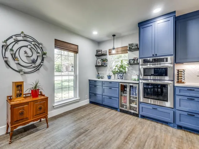 a dining room with furniture window and wooden floor