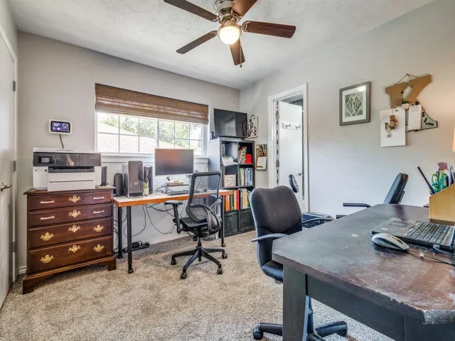 a kitchen with stainless steel appliances a refrigerator and wooden floor