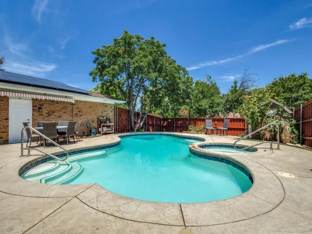 a living room with lots of furniture and window