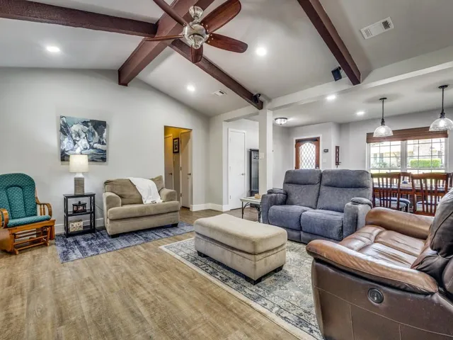 a living room with furniture fireplace and a fireplace