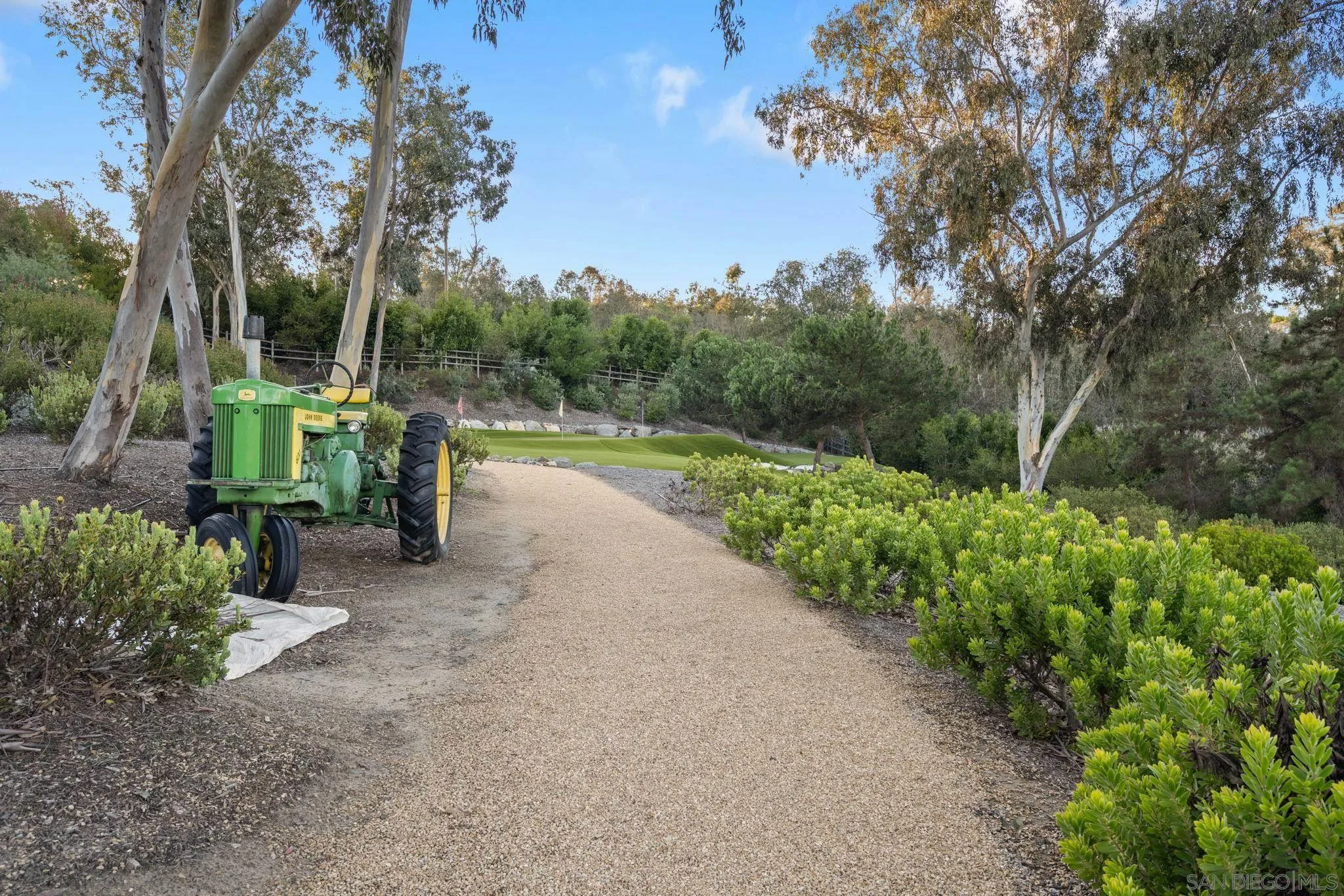 15550 El Camino Real Rancho Santa Fe, CA 92014 - Photo 32 of 35 incredible and private grounds with lite walking trails down to lower garden and detached guest home. The entire property is fenced and gated.