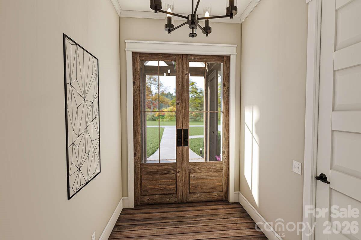 2031 Piper Ridge Drive Lenoir, NC 28645 - Photo 17 of 19 a view of a hallway with wooden floor and windows