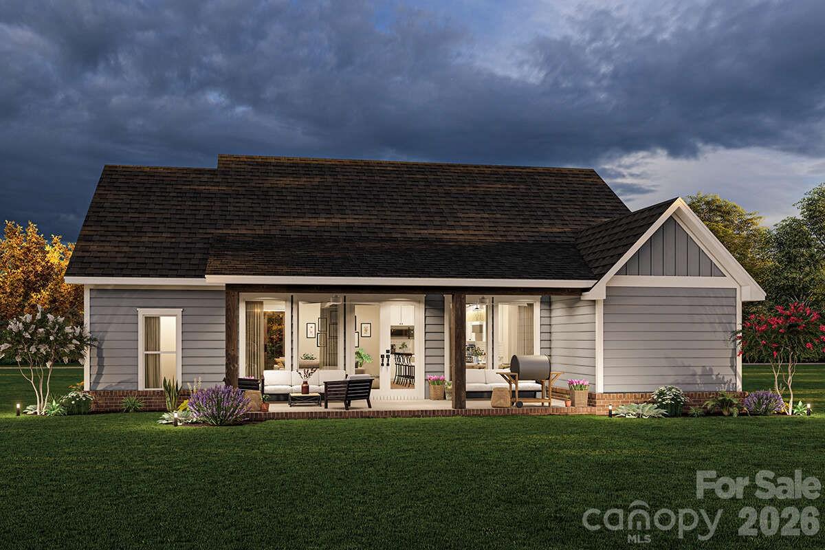 2031 Piper Ridge Drive Lenoir, NC 28645 - Photo 2 of 19 a front view of a house with a garden