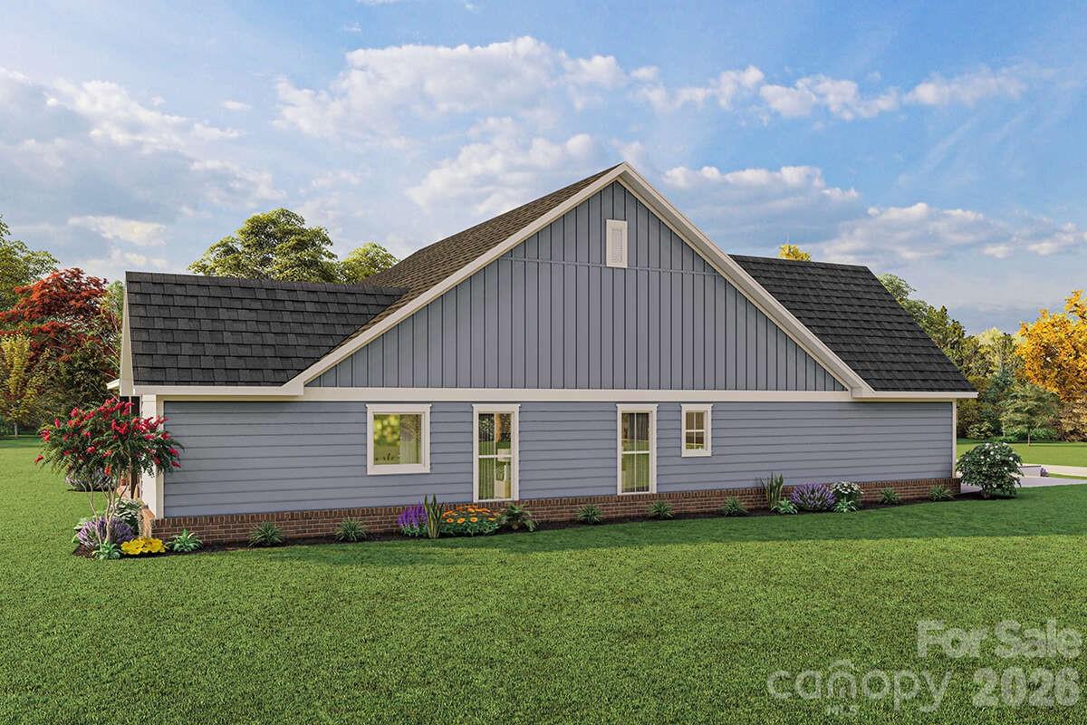 2031 Piper Ridge Drive Lenoir, NC 28645 - Photo 4 of 19 a front view of a house with a garden