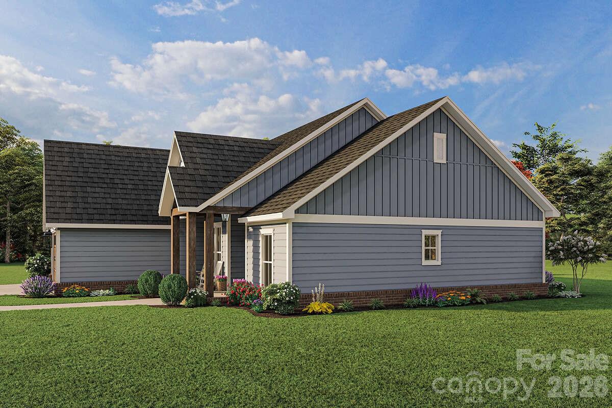 2031 Piper Ridge Drive Lenoir, NC 28645 - Photo 5 of 19 a front view of a house with a garden