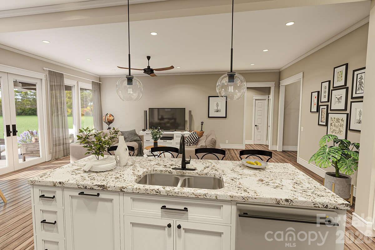 2031 Piper Ridge Drive Lenoir, NC 28645 - Photo 10 of 19 a kitchen with stainless steel appliances kitchen island granite countertop a sink and cabinets