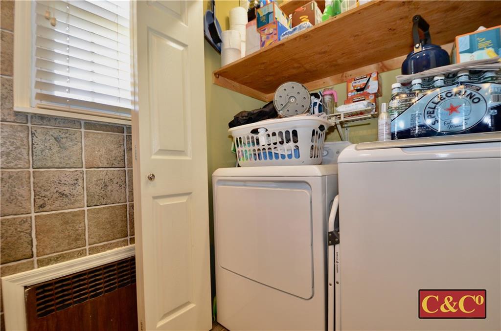 8 Oak Street Valley Stream, NY 11581 - Photo 13 of 40 a utility room with dryer and washer