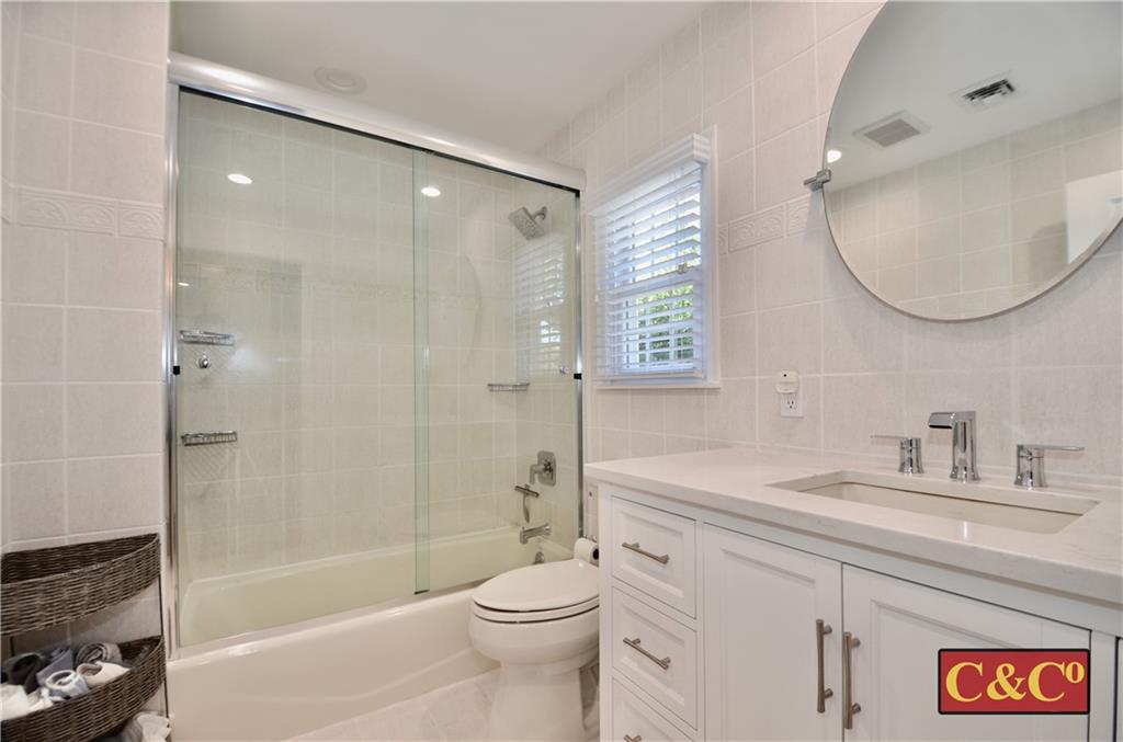 8 Oak Street Valley Stream, NY 11581 - Photo 19 of 40 a bathroom with a sink a toilet and shower