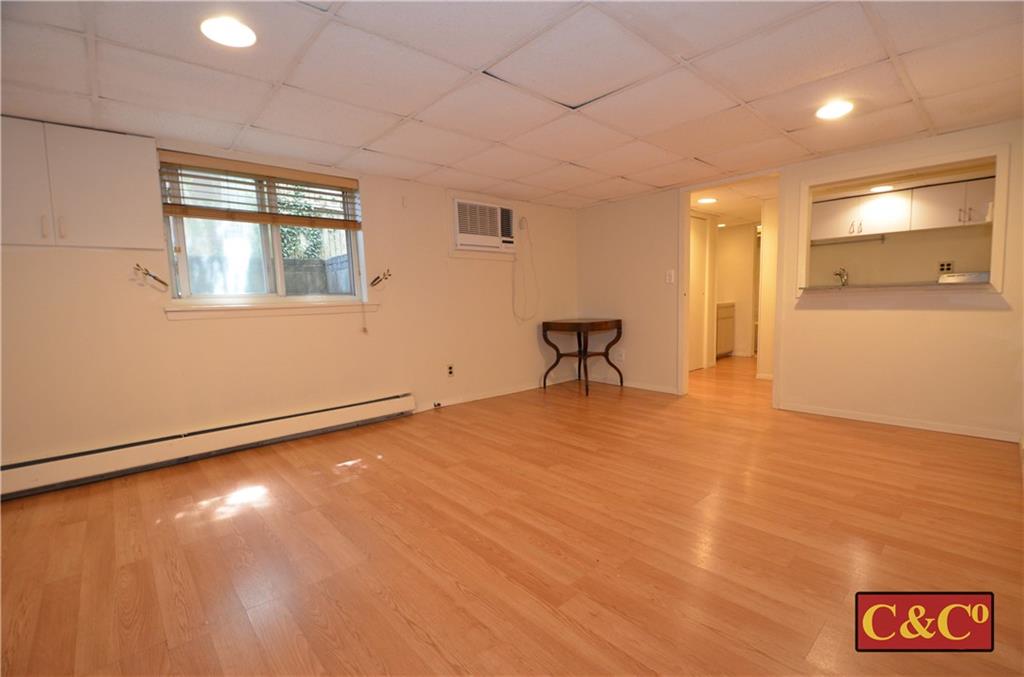 8 Oak Street Valley Stream, NY 11581 - Photo 27 of 40 a view of an empty room with window and wooden floor