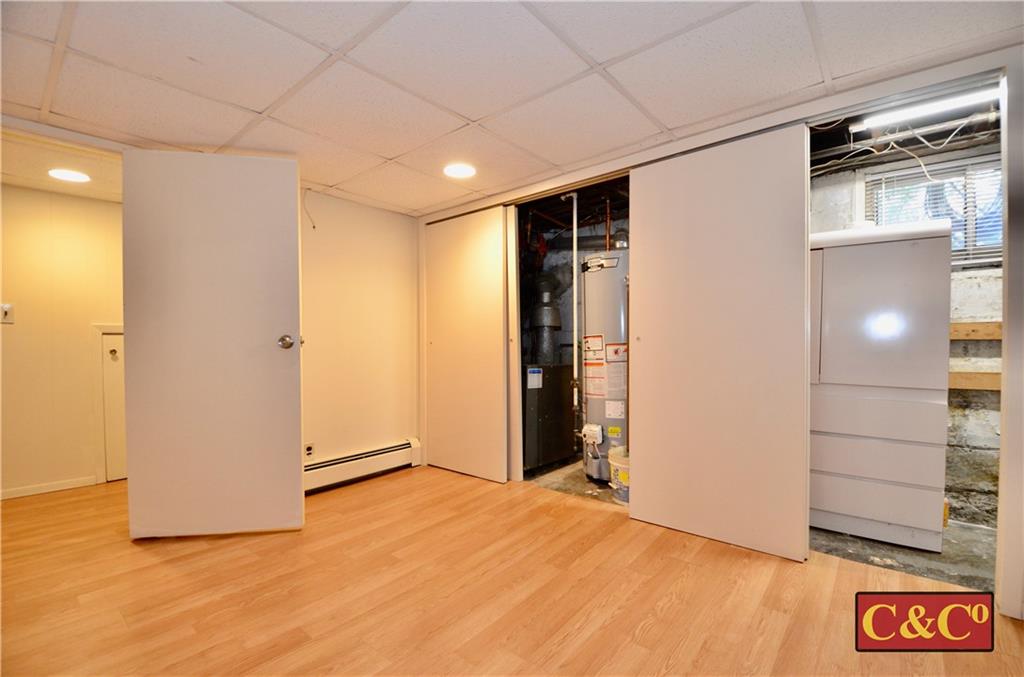 8 Oak Street Valley Stream, NY 11581 - Photo 31 of 40 a view of empty room with wooden floor