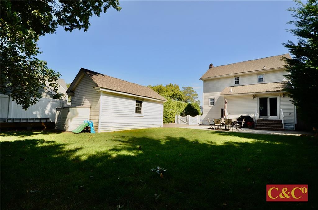 8 Oak Street Valley Stream, NY 11581 - Photo 34 of 40 a view of a house with a yard