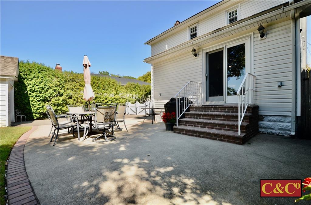 8 Oak Street Valley Stream, NY 11581 - Photo 35 of 40 a view of a patio with a table and chairs