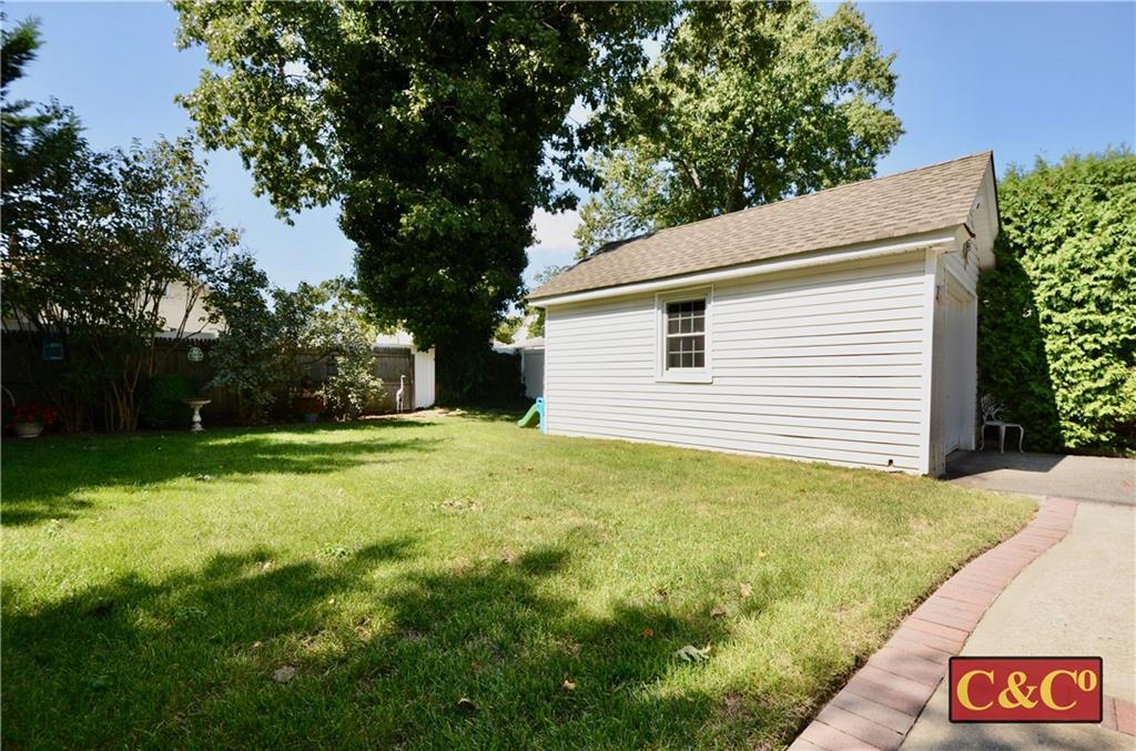 8 Oak Street Valley Stream, NY 11581 - Photo 36 of 40 a view of a backyard with large trees