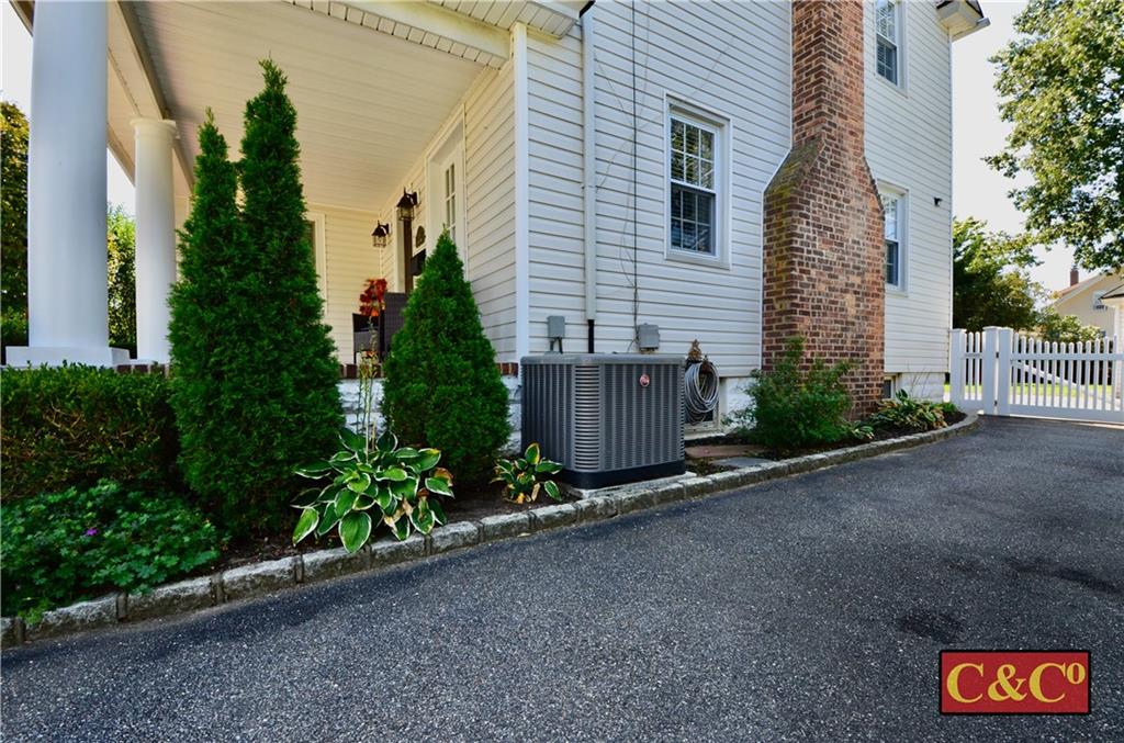 8 Oak Street Valley Stream, NY 11581 - Photo 38 of 40 a view of a house with brick walls and plants