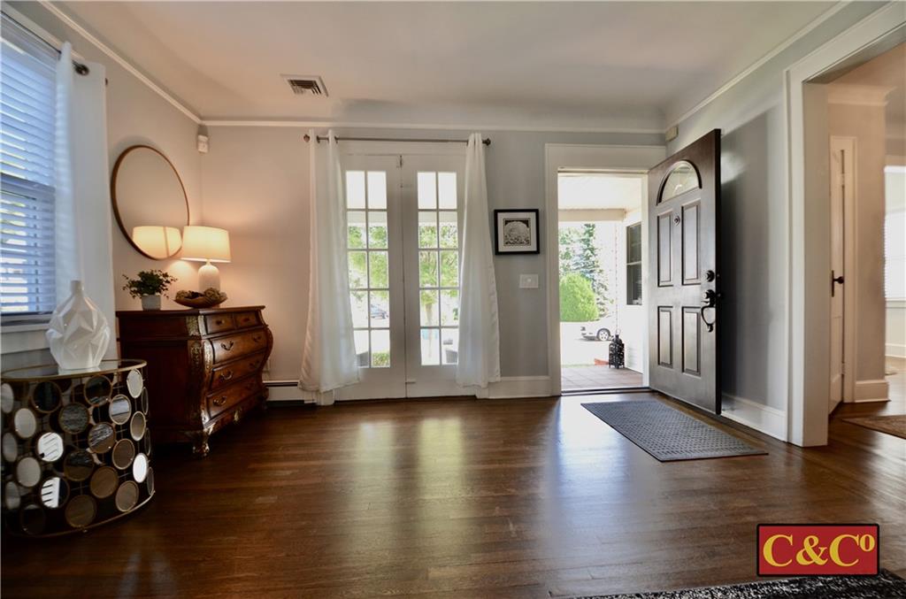 8 Oak Street Valley Stream, NY 11581 - Photo 5 of 40 a living room with furniture window wooden floor and glass door