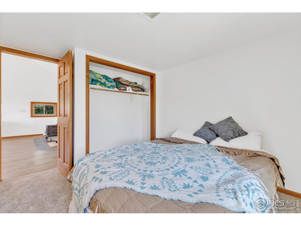 57 Nelson Street Ward, CO 80481 - Photo 21 of 27 a bedroom with a bed and lamp