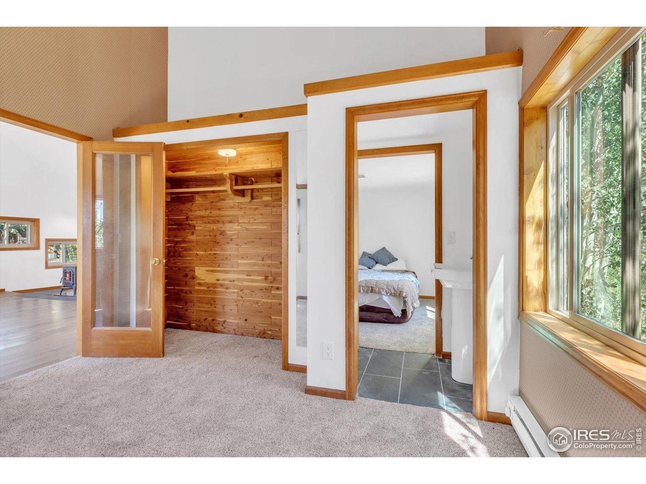 57 Nelson Street Ward, CO 80481 - Photo 22 of 27 a view of a hallway and a livingroom with furniture