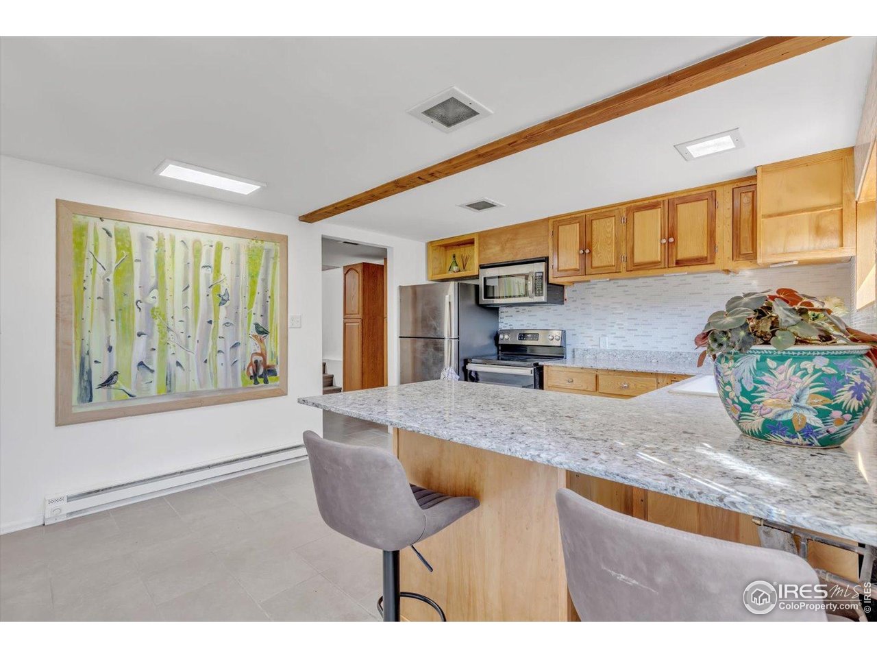57 Nelson Street Ward, CO 80481 - Photo 6 of 27 a kitchen with stainless steel appliances granite countertop a sink and a wooden cabinets