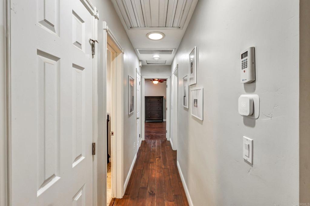 11985 Rocoso Road Lakeside, CA 92040 - Photo 19 of 48 a view of a hallway with wooden floor