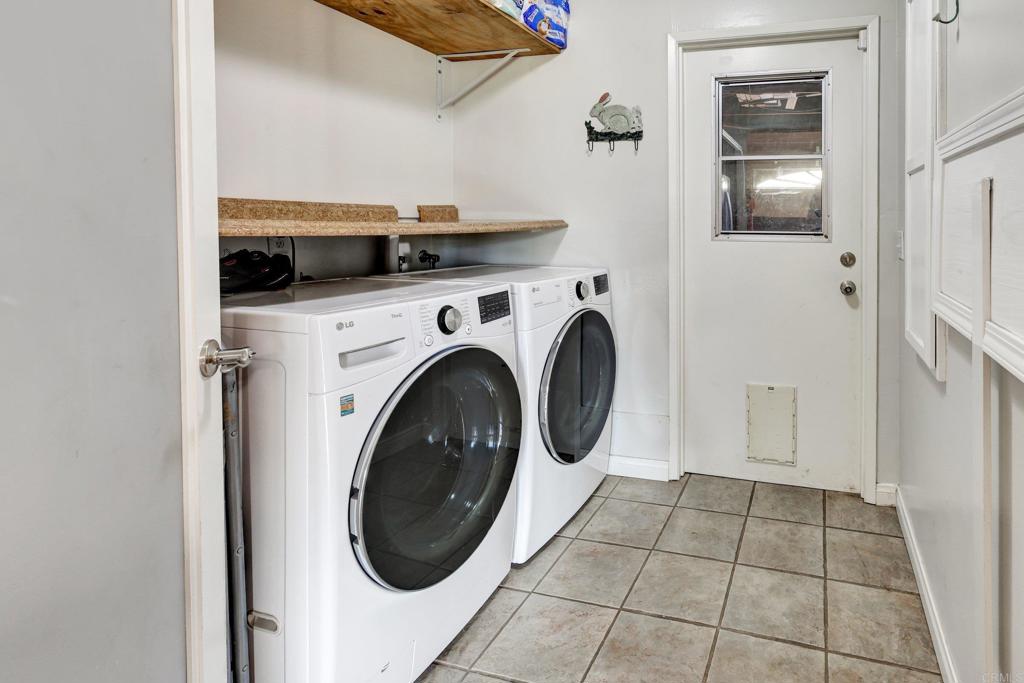 11985 Rocoso Road Lakeside, CA 92040 - Photo 30 of 48 a view of a storage & utility room with washer and dryer