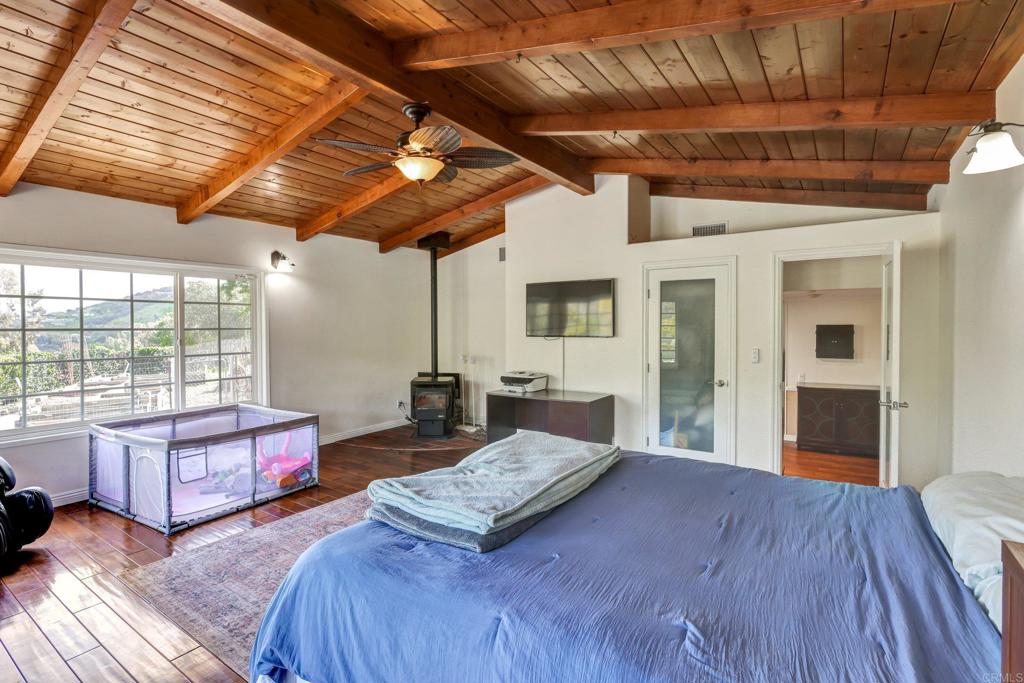 11985 Rocoso Road Lakeside, CA 92040 - Photo 32 of 48 a bedroom with furniture and large window