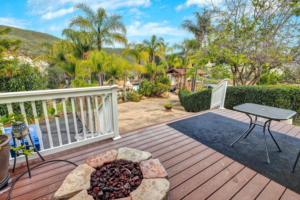 11985 Rocoso Road Lakeside, CA 92040 - Photo 35 of 48 a view of balcony with wooden floor and outdoor seating