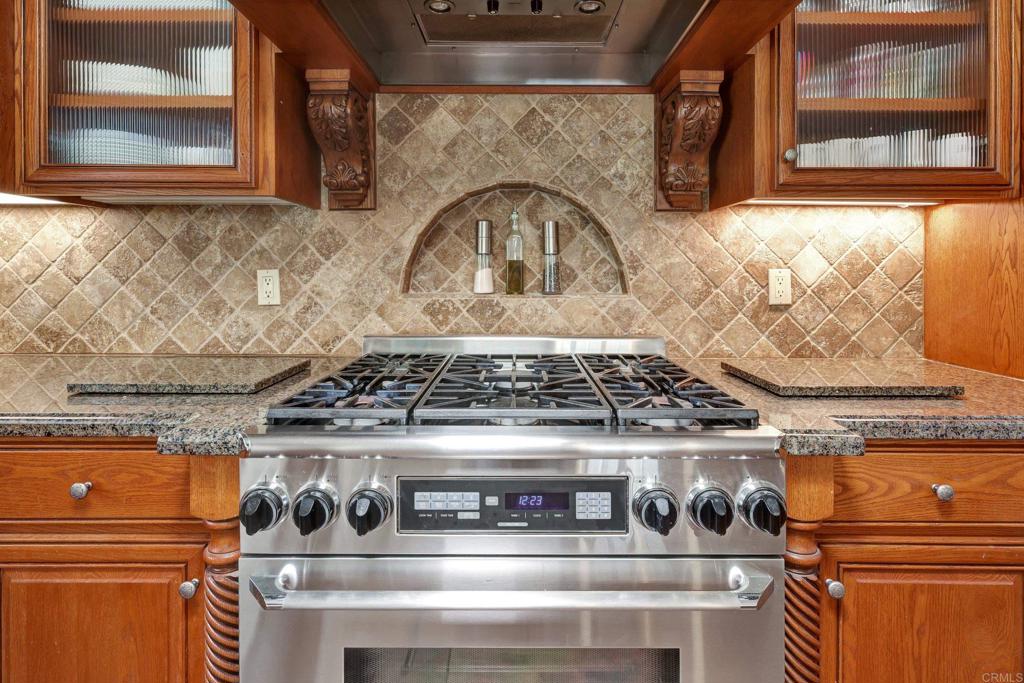 11985 Rocoso Road Lakeside, CA 92040 - Photo 10 of 48 a stove top oven sitting inside of a kitchen