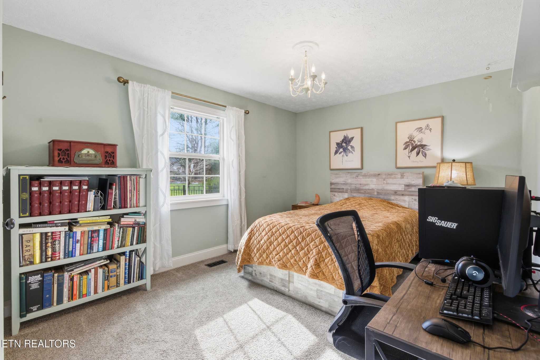10508 River Ridge Road Knoxville, TN 37922 - Photo 17 of 29 a bedroom with a bed and a book shelf