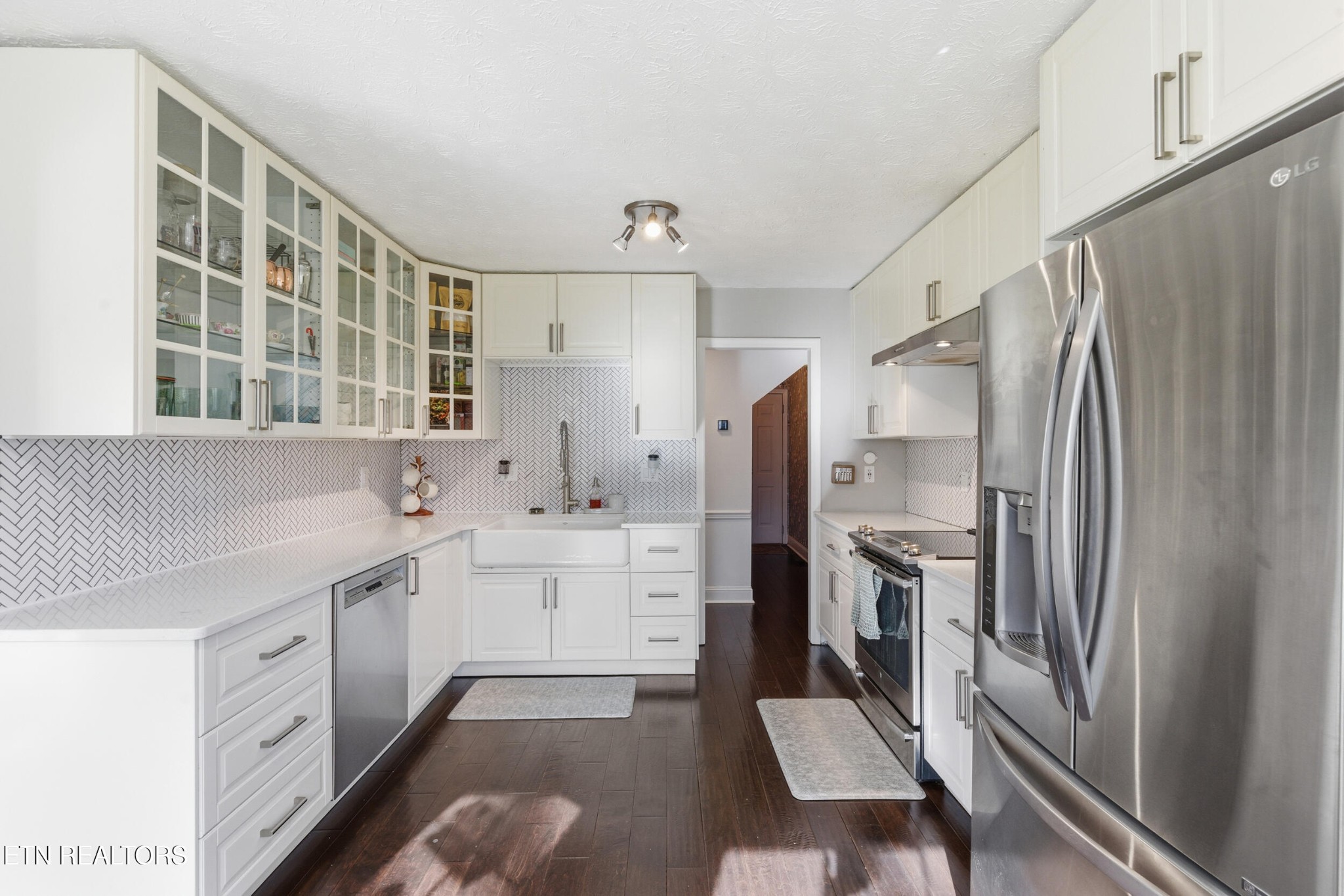 10508 River Ridge Road Knoxville, TN 37922 - Photo 9 of 29 a kitchen with white cabinets and stainless steel appliances