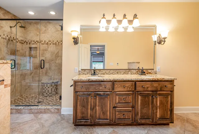 a bathroom with bathtub and shower