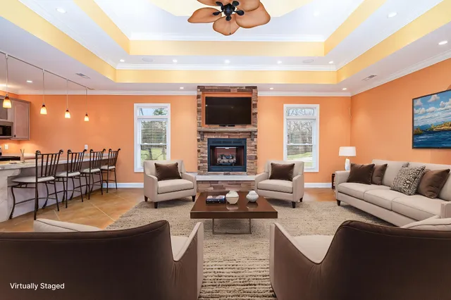 a kitchen with kitchen island granite countertop appliances cabinets and a dining table