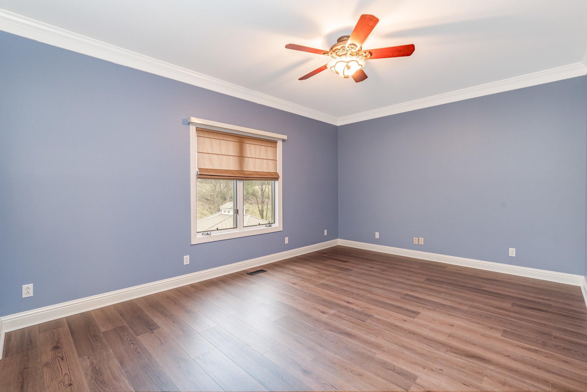 5827 Highway 76 East Springfield, TN 37172 - Photo 22 of 77 an empty room with a window and a ceiling fan