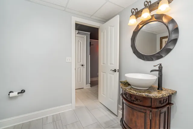 a dining table with chairs and window