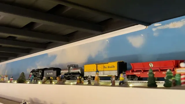 a bathroom with a shower a sink and a mirror