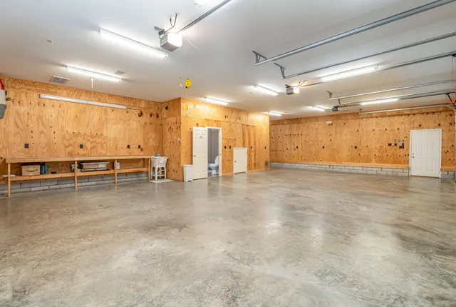 a kitchen with a stove sink and cabinets