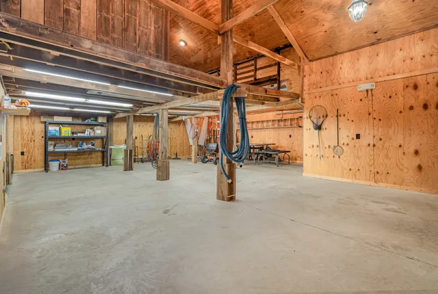 a bathroom with a shower sink and mirror