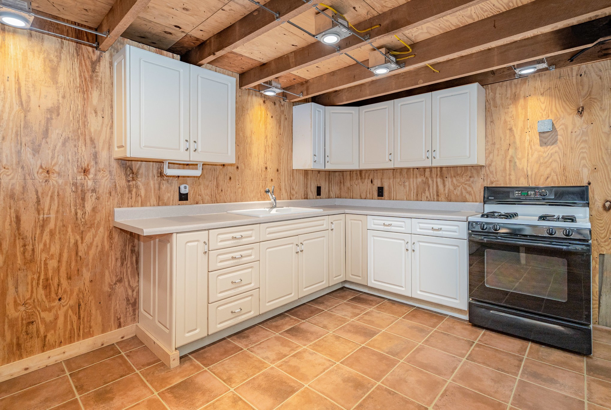 5827 Highway 76 East Springfield, TN 37172 - Photo 39 of 77 a kitchen with a stove sink and cabinets