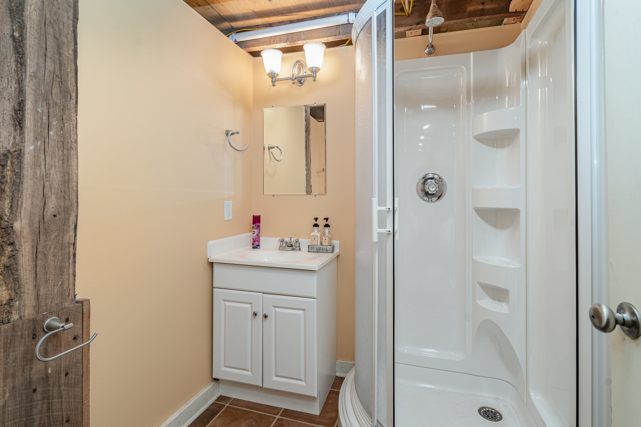 5827 Highway 76 East Springfield, TN 37172 - Photo 40 of 77 a bathroom with a shower sink and mirror