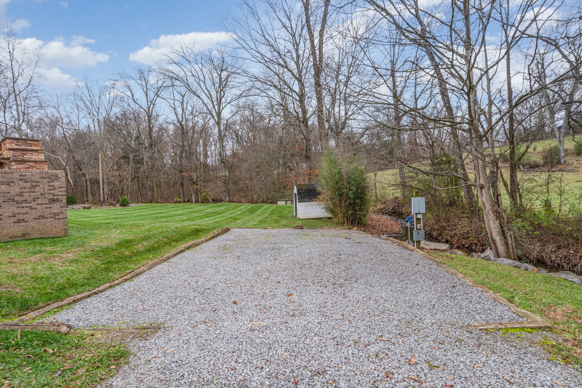 5827 Highway 76 East Springfield, TN 37172 - Photo 55 of 77 a view of a backyard with large trees